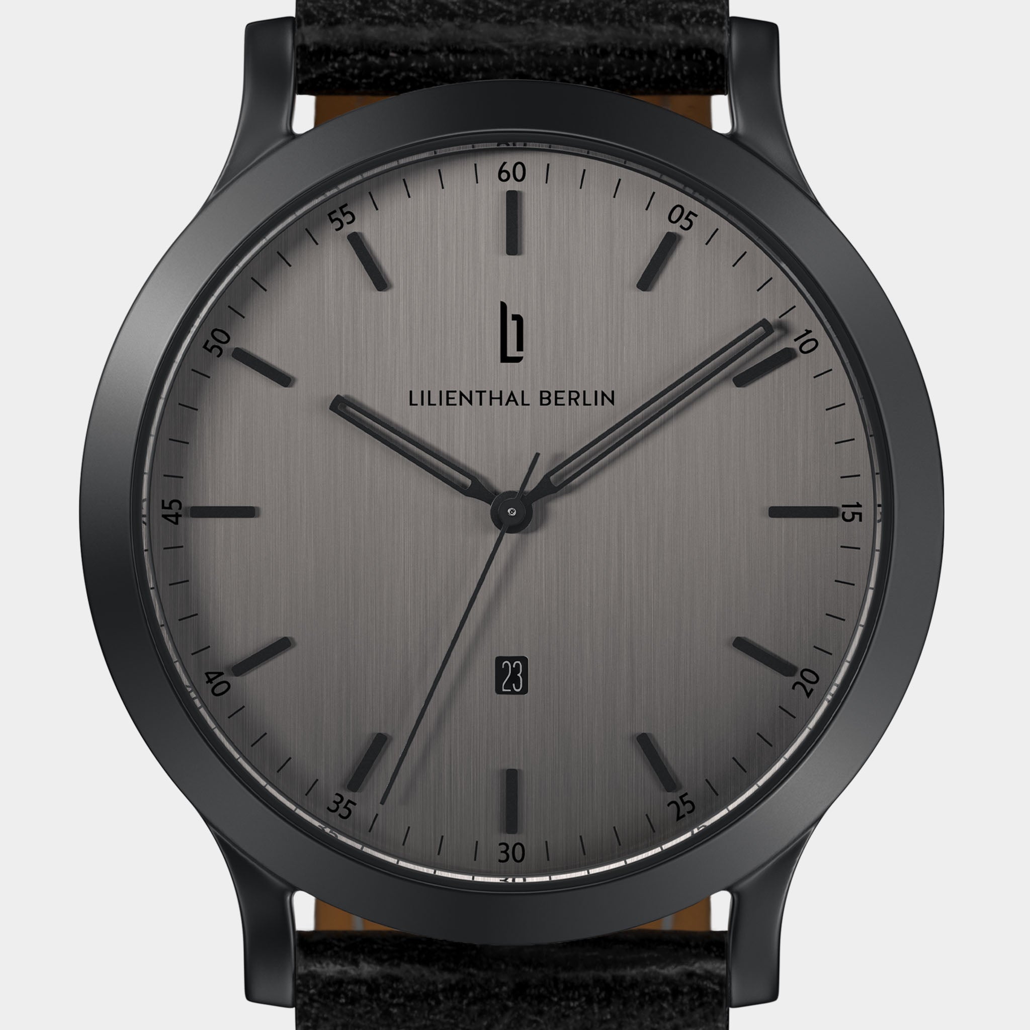 Minimalist grey wristwatch with black markers, black case, and date display at 6 o'clock.