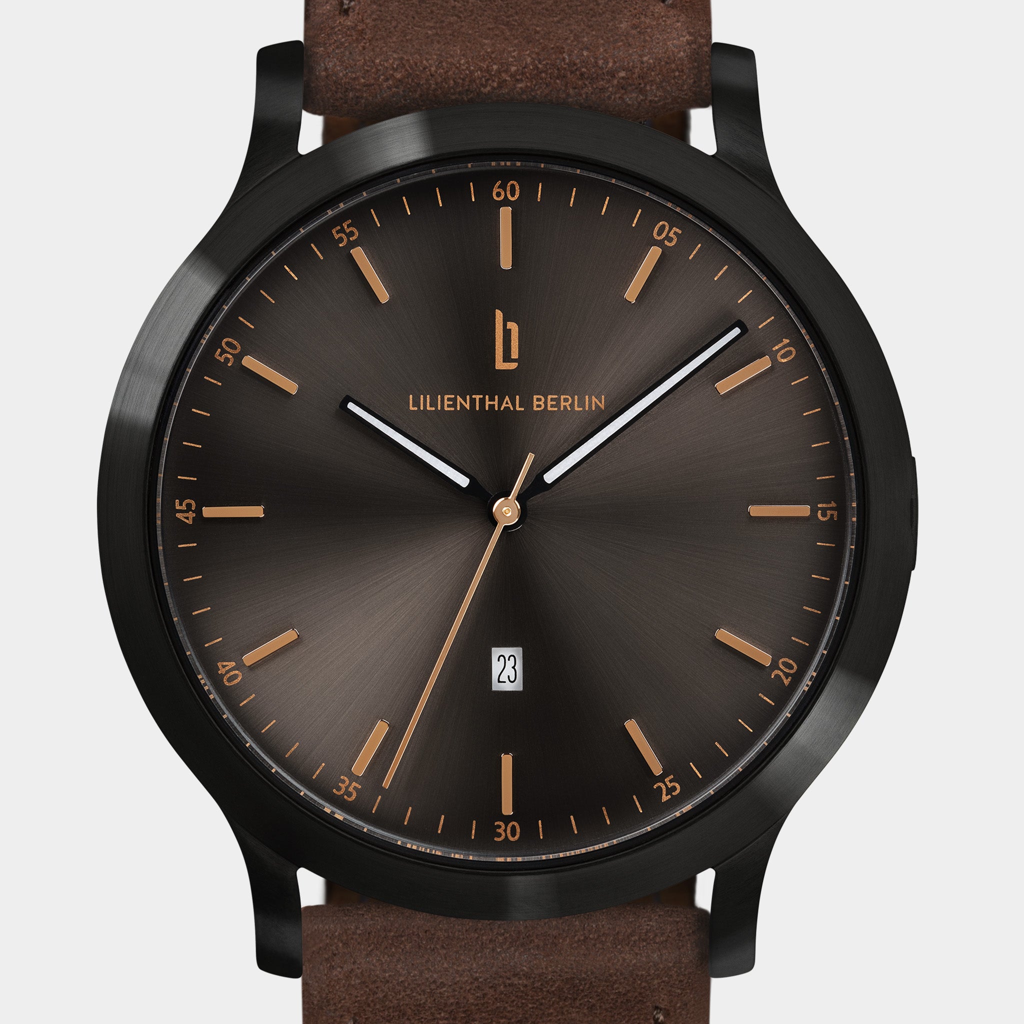 Minimalist black and brown wristwatch with date display and leather strap