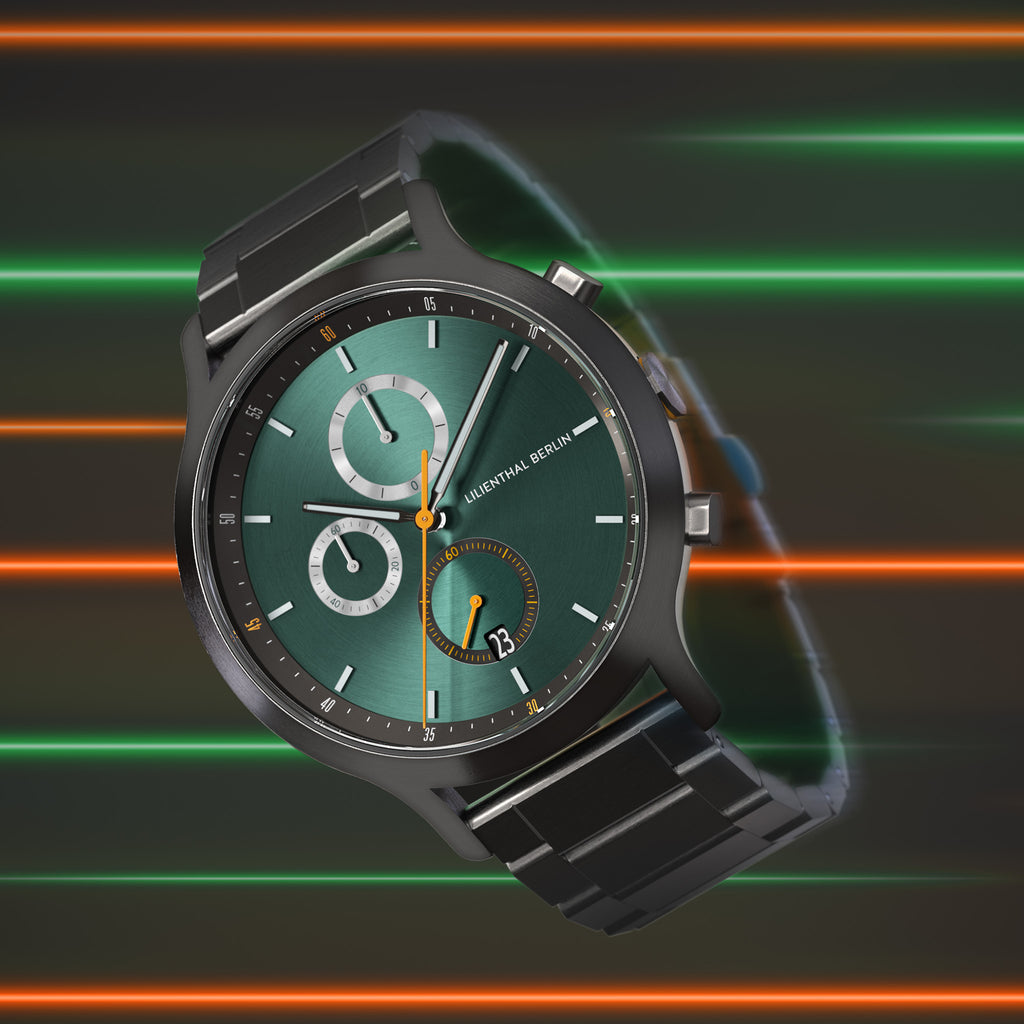 Modern green dial chronograph watch with metal strap, colorful neon stripes background