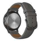 Back view of a chronograph watch with gray leather strap and stainless steel case