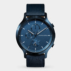 Blue chronograph wristwatch with textured face, date display, and leather strap