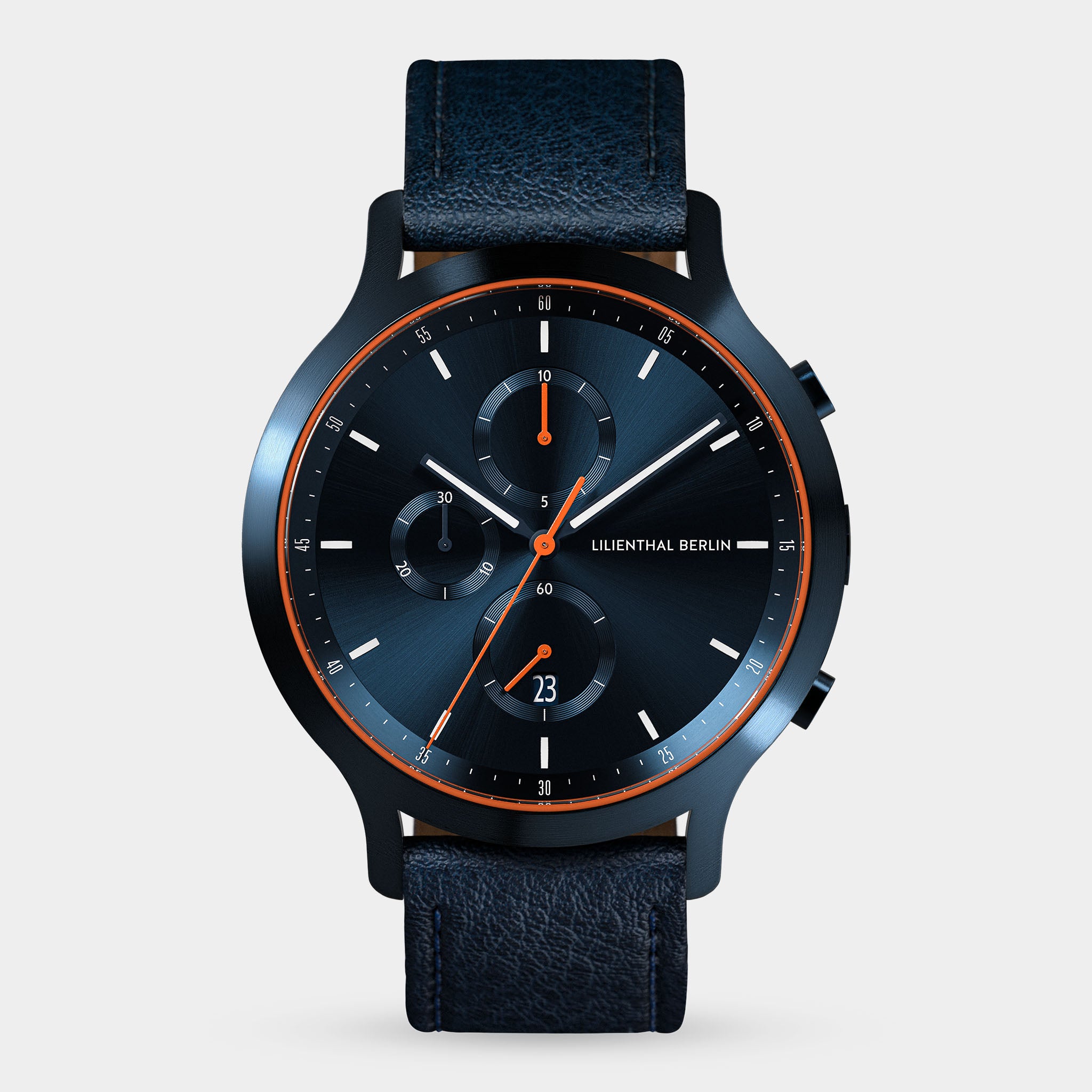Modern navy blue chronograph watch with leather strap, black dial, and orange accents.
