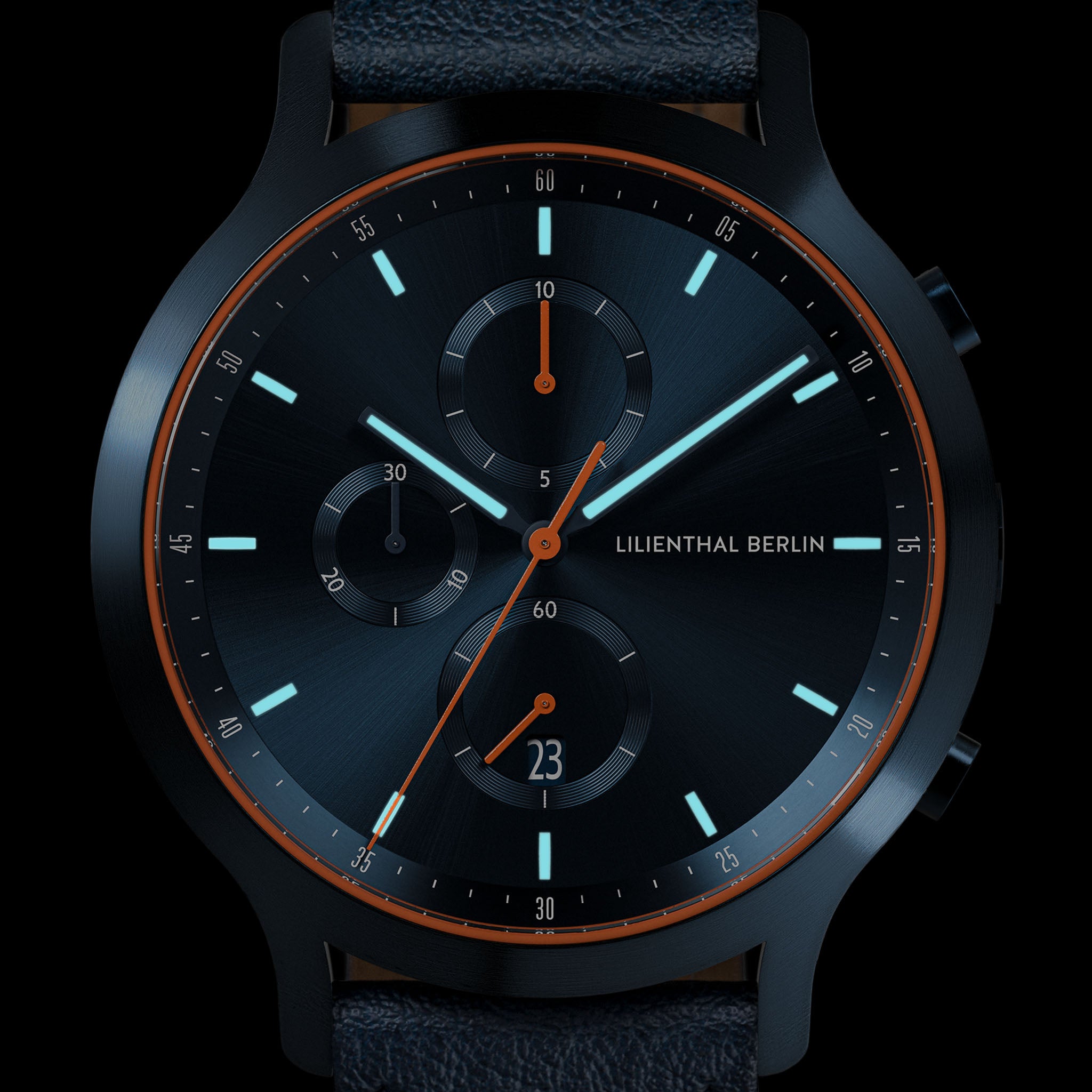 Black chronograph wristwatch with blue dial, subdials, and orange accents on hands and rim.