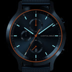 Black chronograph watch with orange detailing, sleek dial, and luminous hour markers