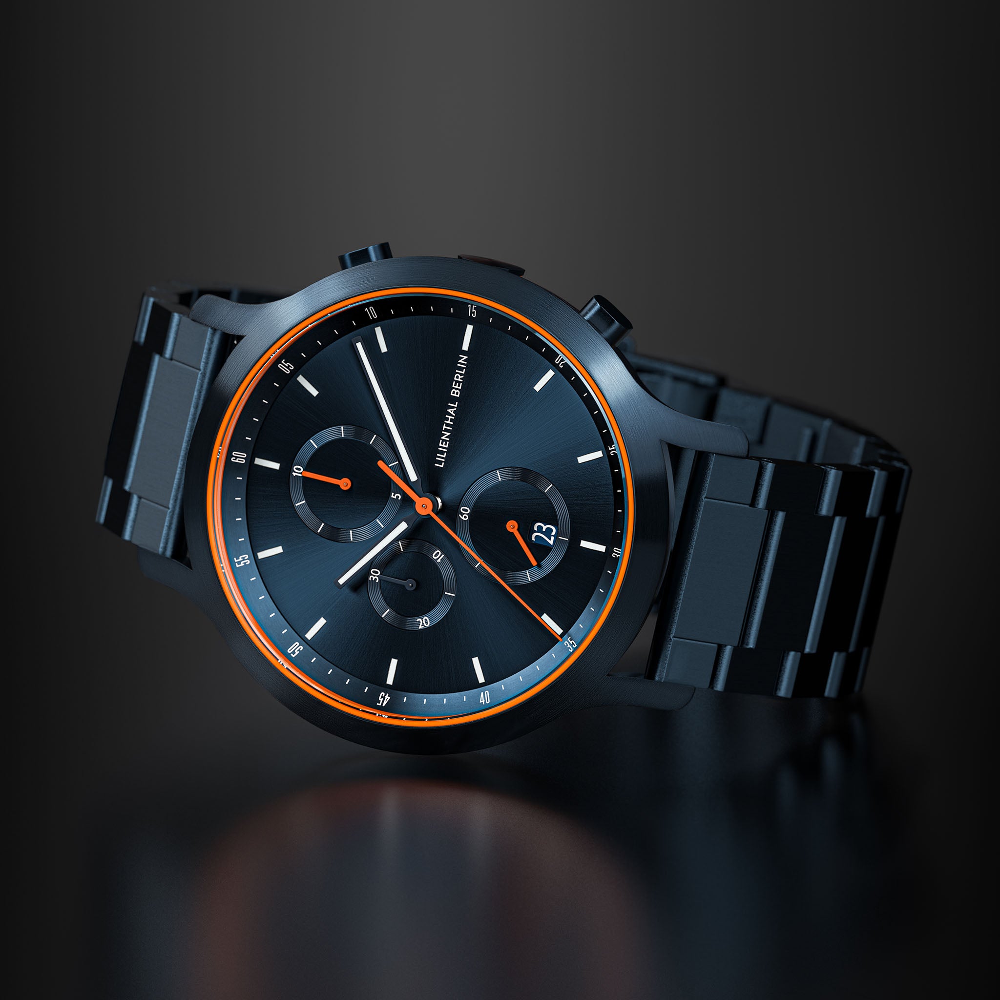Sleek black chronograph watch with orange accents and metal bracelet on dark background