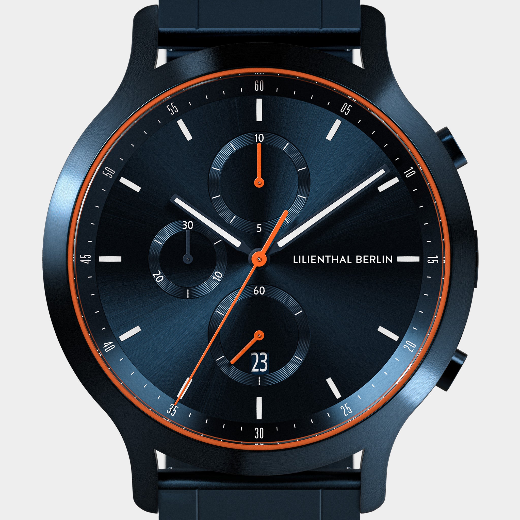 Modern black chronograph watch with bold orange accents and subdials on a dark face