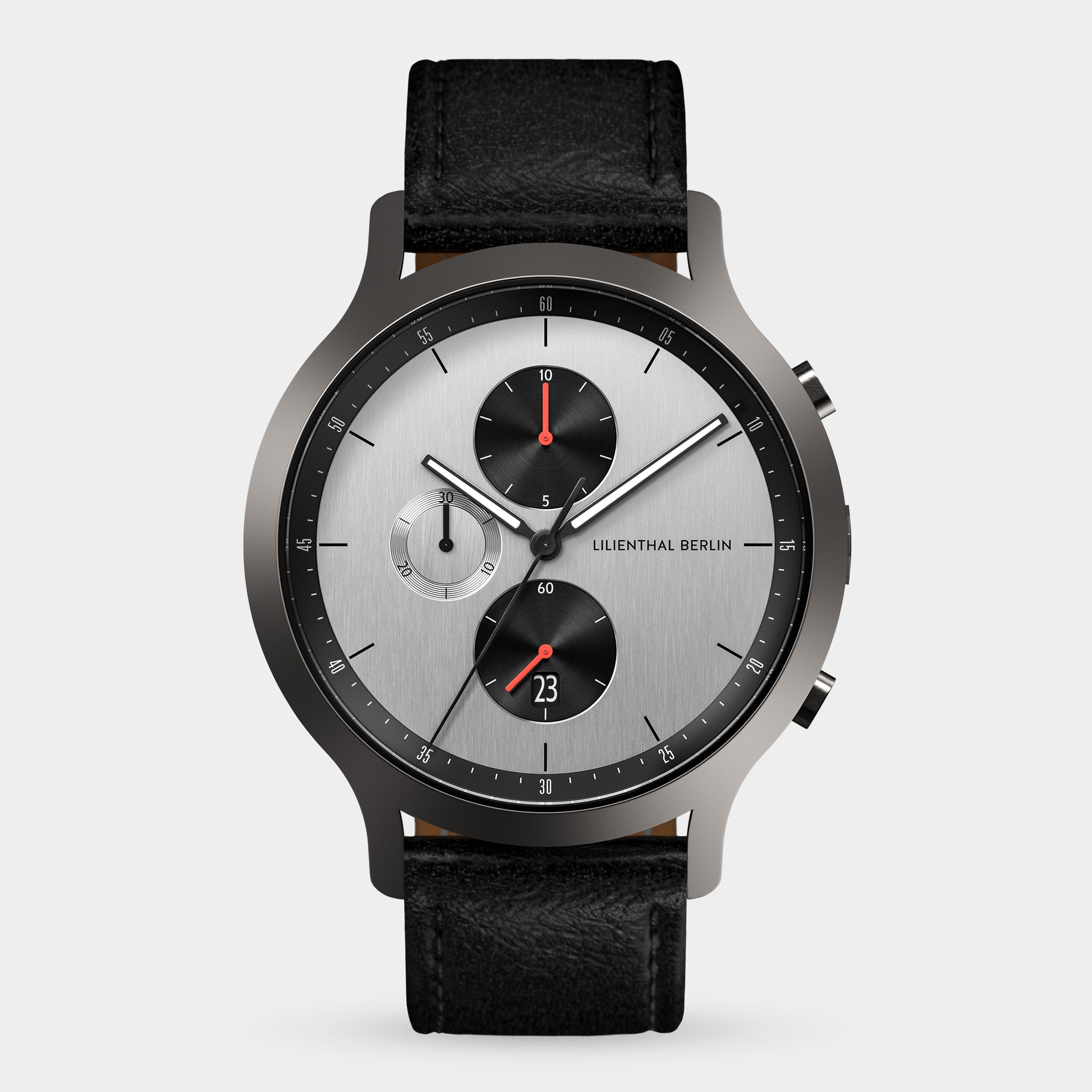 Silver chronograph watch with black leather strap, multi-dial face, and red accents