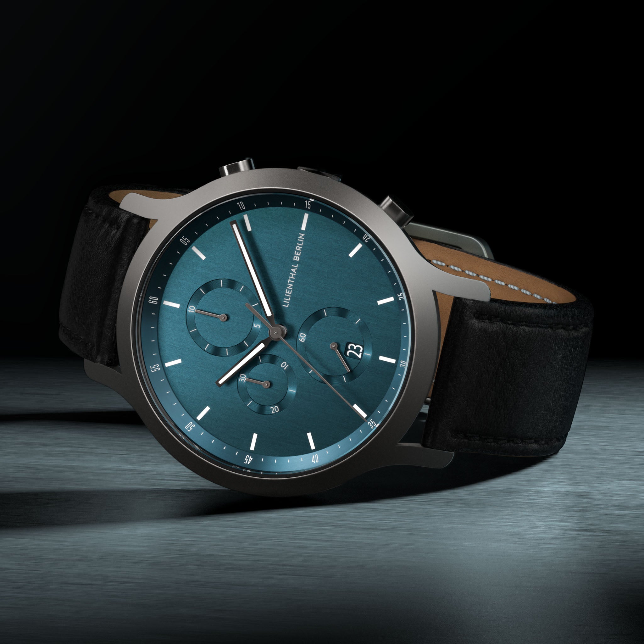 Minimalist men's chronograph watch with blue dial, black leather strap, stainless steel case