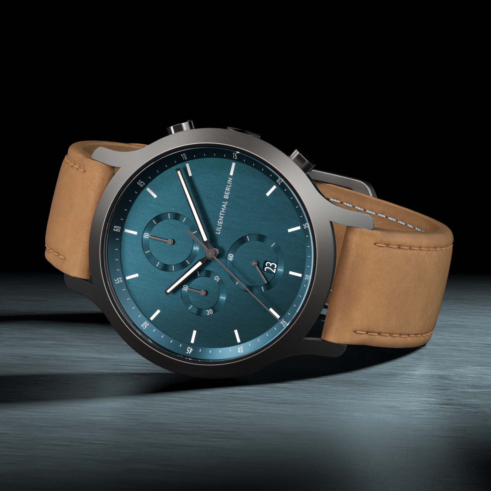 Men's chronograph watch with blue dial, brown leather strap, and stainless steel case