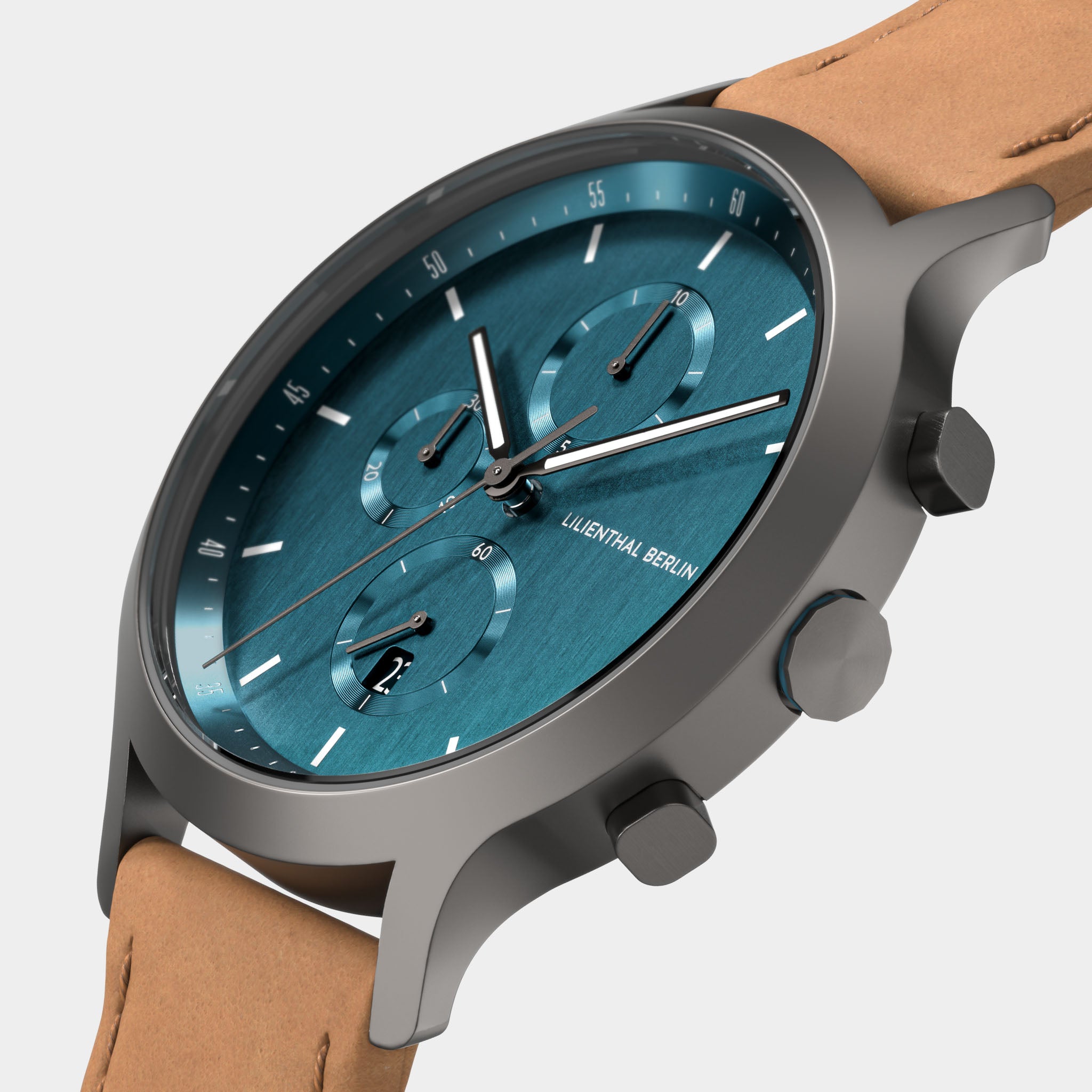 Modern chronograph watch with blue dial, three subdials, and tan leather strap