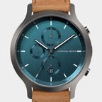 Modern chronograph watch with blue dial, subdials, date display, and tan leather strap