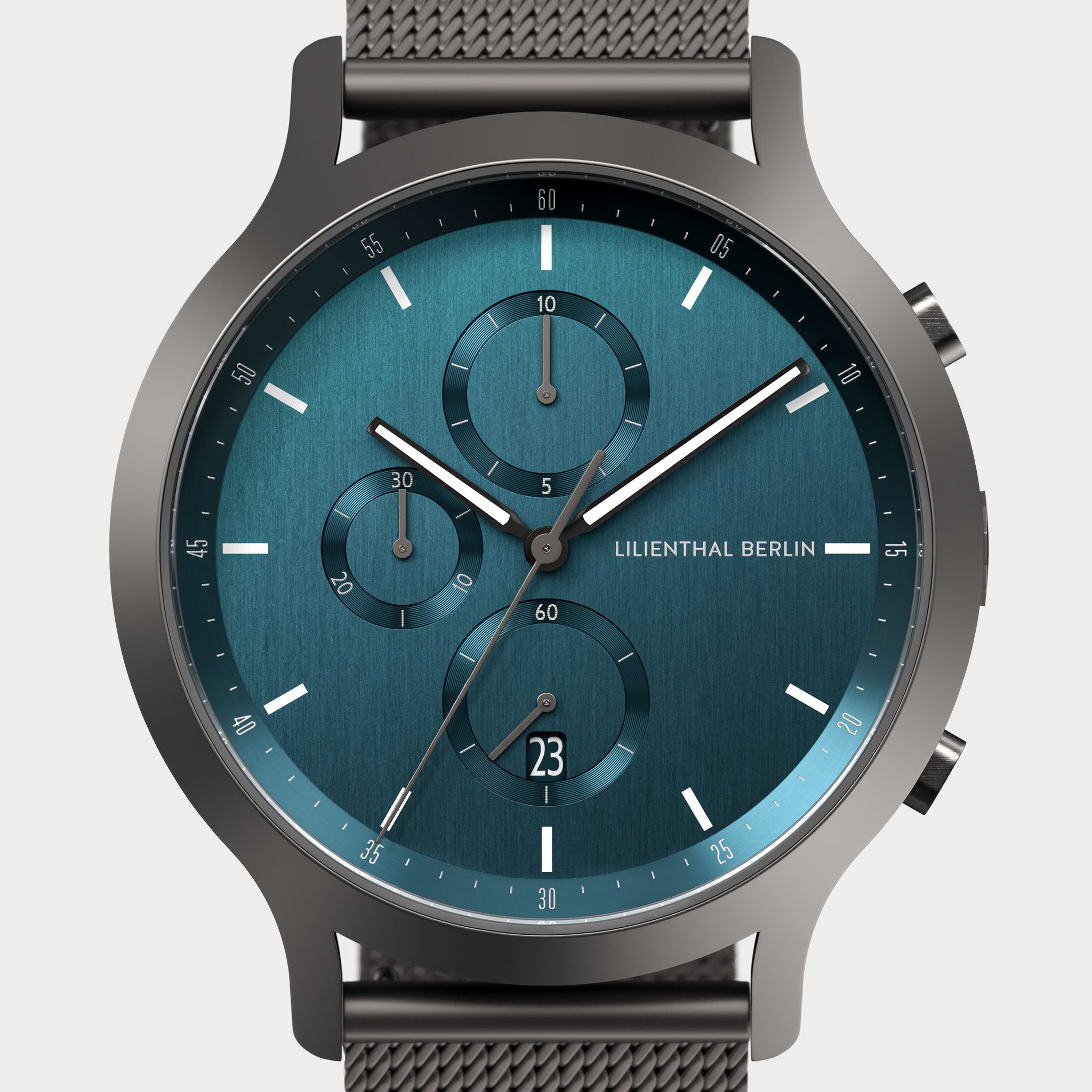 Blue chronograph watch with mesh strap, subdials, and date window, modern minimalist design
