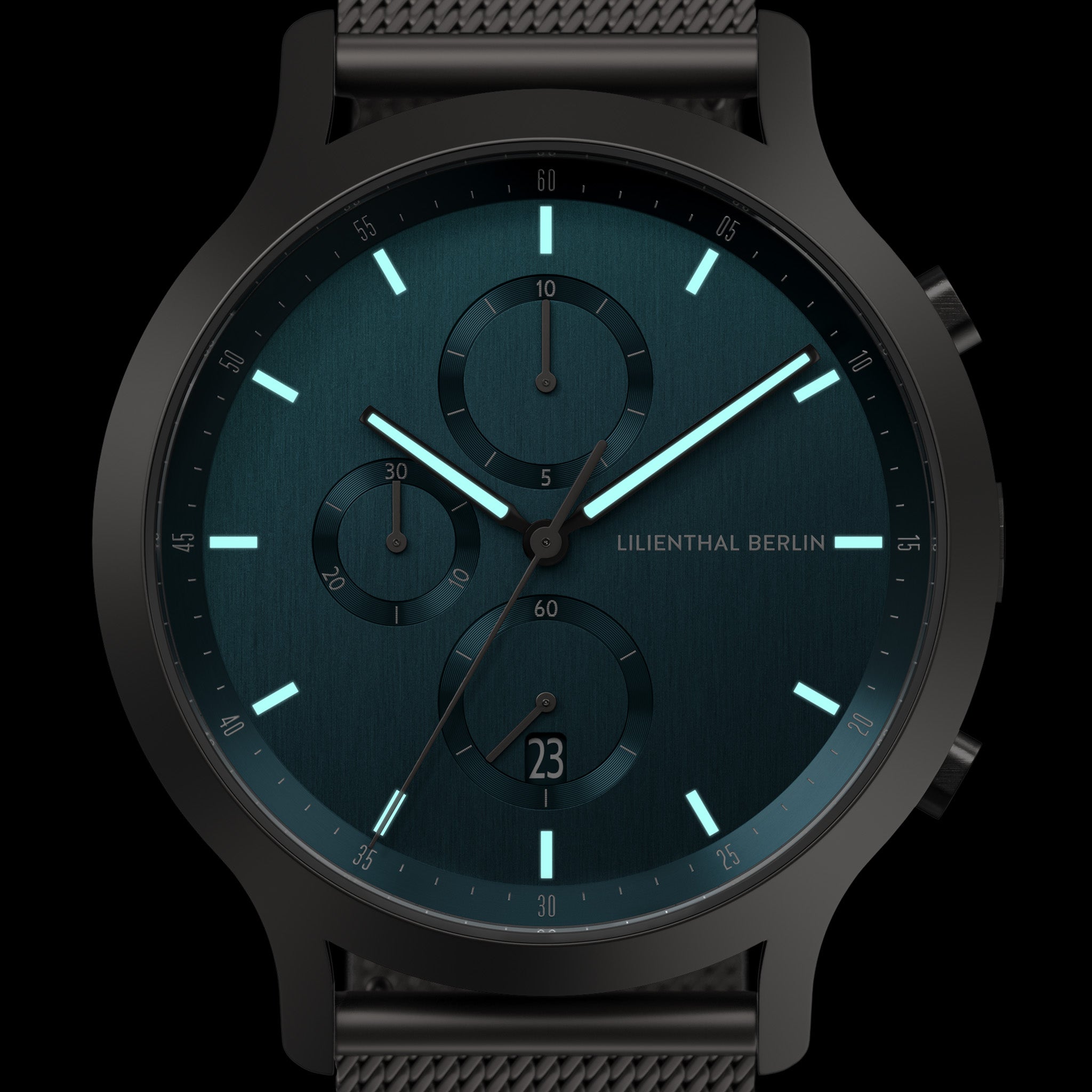 Modern chronograph watch with blue dial, black mesh strap, and luminous markers
