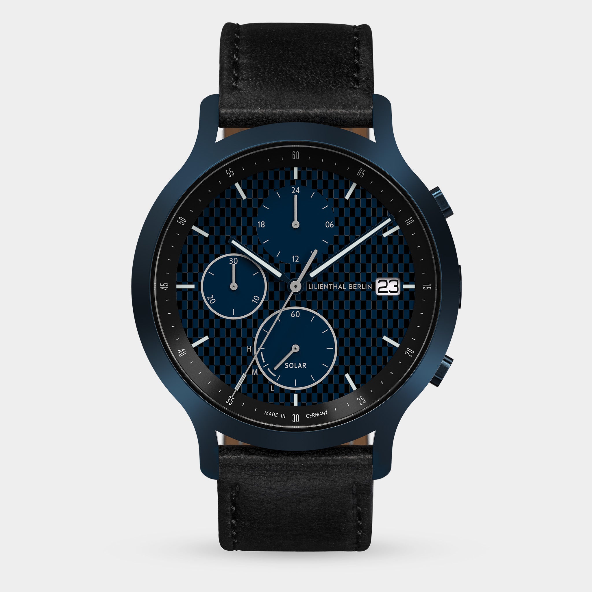 Solar chronograph watch with blue-black checkered dial, subdials, date window, black leather strap