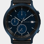 Blue chronograph solar watch with black checkered dial, subdials, and date display