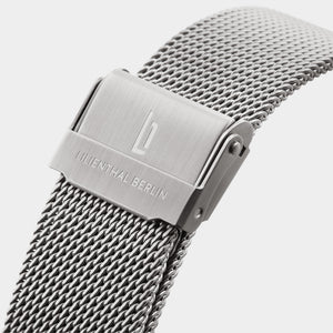 Stainless steel mesh watch strap with brushed clasp and engraved logo