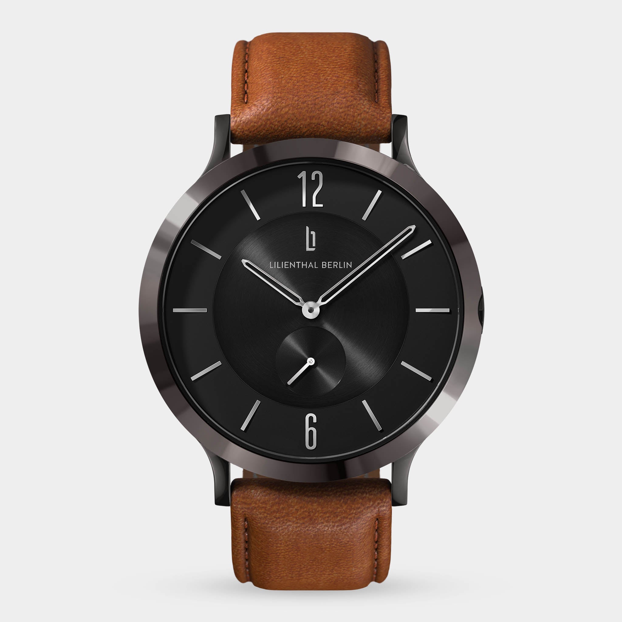 Minimalist black watch with brown leather strap, silver markers, and clean modern design