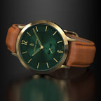 Elegant wristwatch with a green dial, gold accents, and brown leather strap on dark background