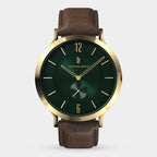 Elegant gold watch with green dial and brown leather strap, minimalist design