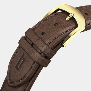Brown leather watch strap with gold buckle and stitched detailing